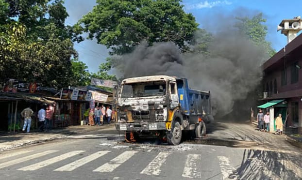 রাজশাহীতে সড়কে প্রাণ গেল ব্যবসায়ীর, আগুনে পুড়ল দুই ডাম্প ট্রাক